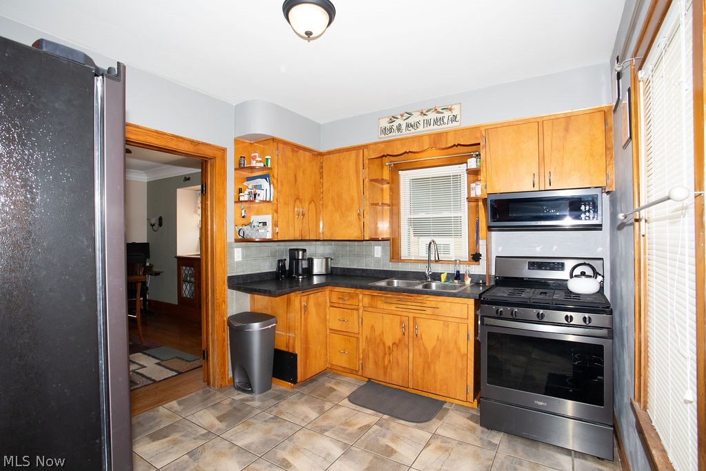 213 Como Street Struthers, OH 44471 - Photo 7 of 25 Kitchen includes all stainless steel appliances including built in microwave