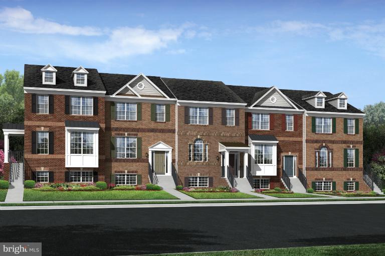 2653 Shade Branch Road, Unit 47 Hanover, MD 21076 - Photo 5 of 6 a front view of a residential apartment building with a yard