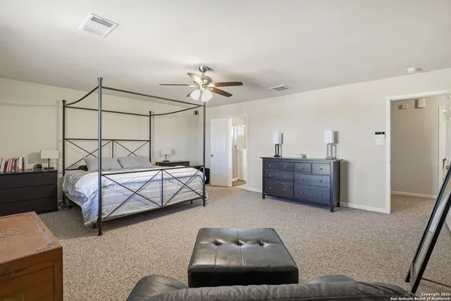 a bedroom with furniture and window