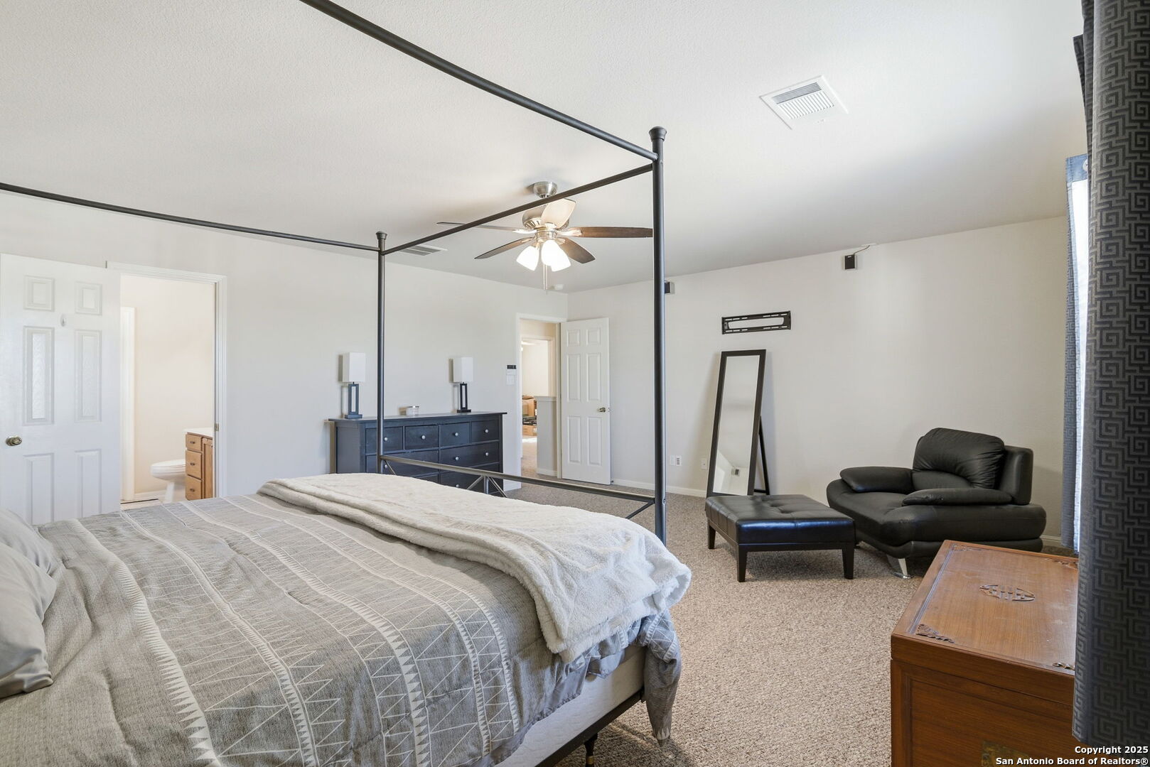 133 Falling Sun Cibolo, TX 78108 - Photo 14 of 27 a bedroom with bed and a chair