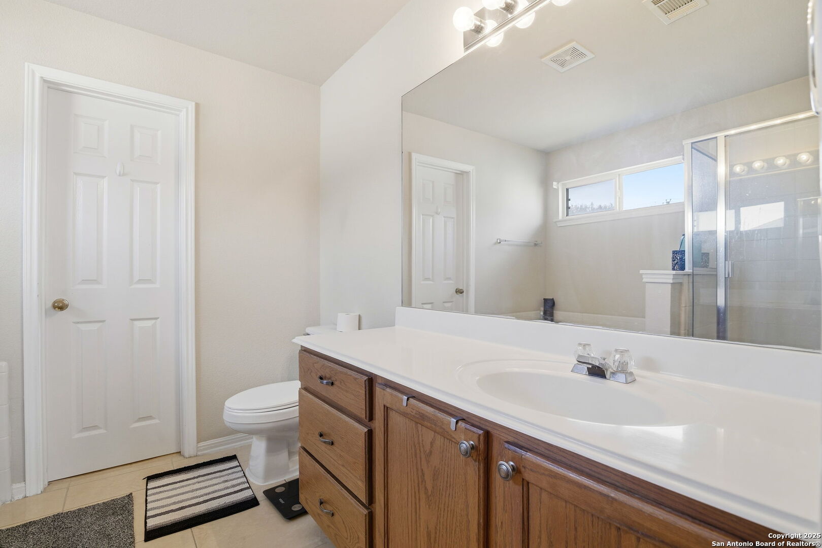 133 Falling Sun Cibolo, TX 78108 - Photo 16 of 28 a bathroom with a sink a toilet and shower