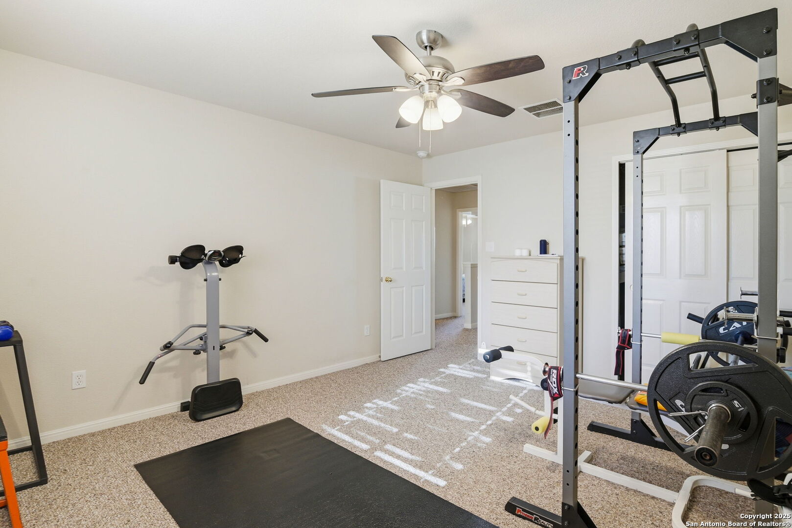 133 Falling Sun Cibolo, TX 78108 - Photo 20 of 27 a view of a room with gym equipment