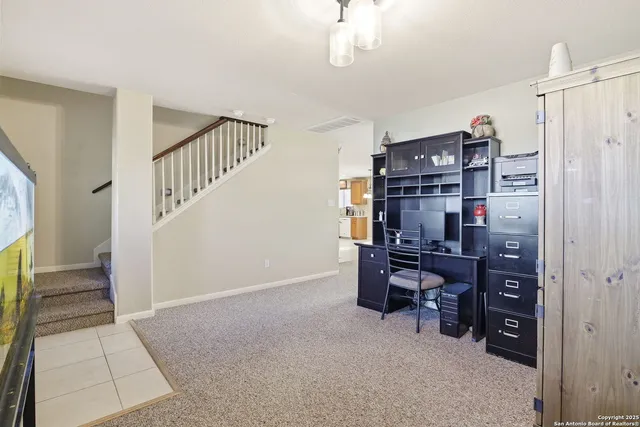 a view of a workspace with furniture