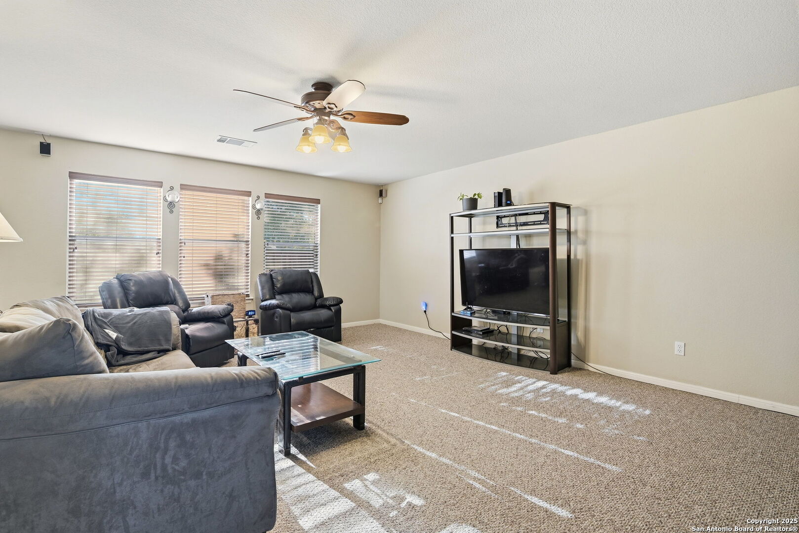 133 Falling Sun Cibolo, TX 78108 - Photo 7 of 28 a living room with furniture and a flat screen tv