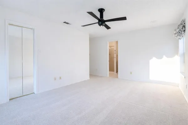 a view of a big room with carpet