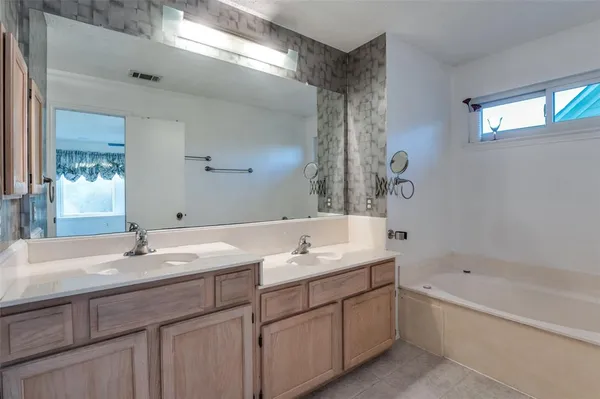 a bathroom with a sink and a bathtub