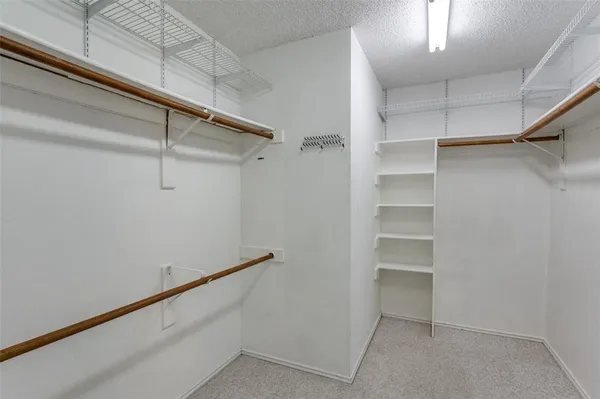 a view of an empty walk in closet