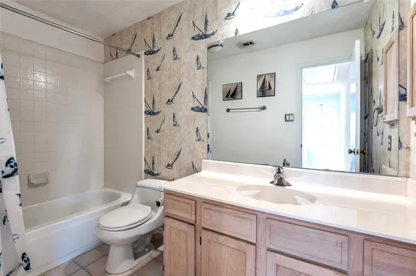 a bathroom with a sink a toilet and a bathtub