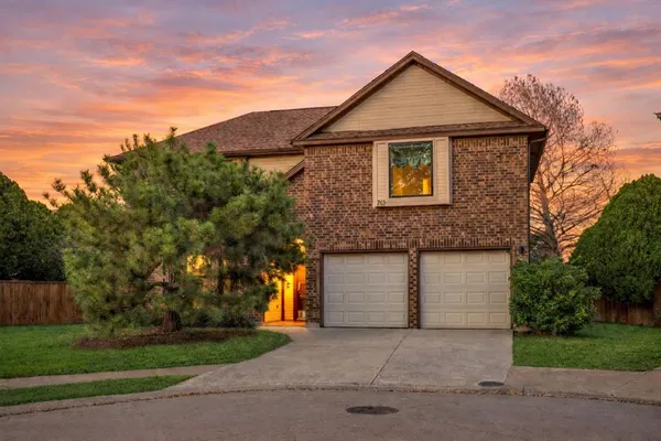 a front view of a house with garage
