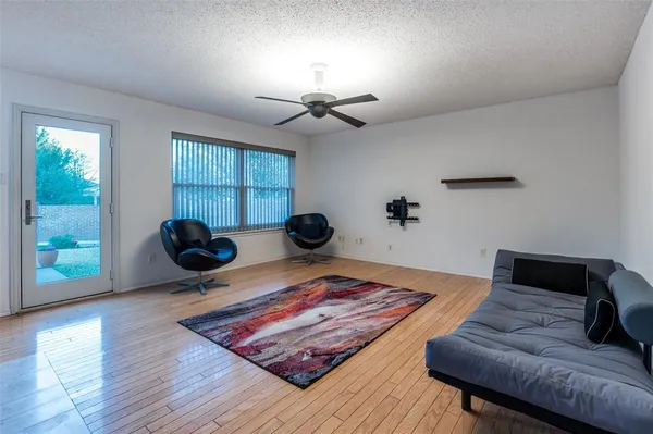 a living room with furniture and a rug