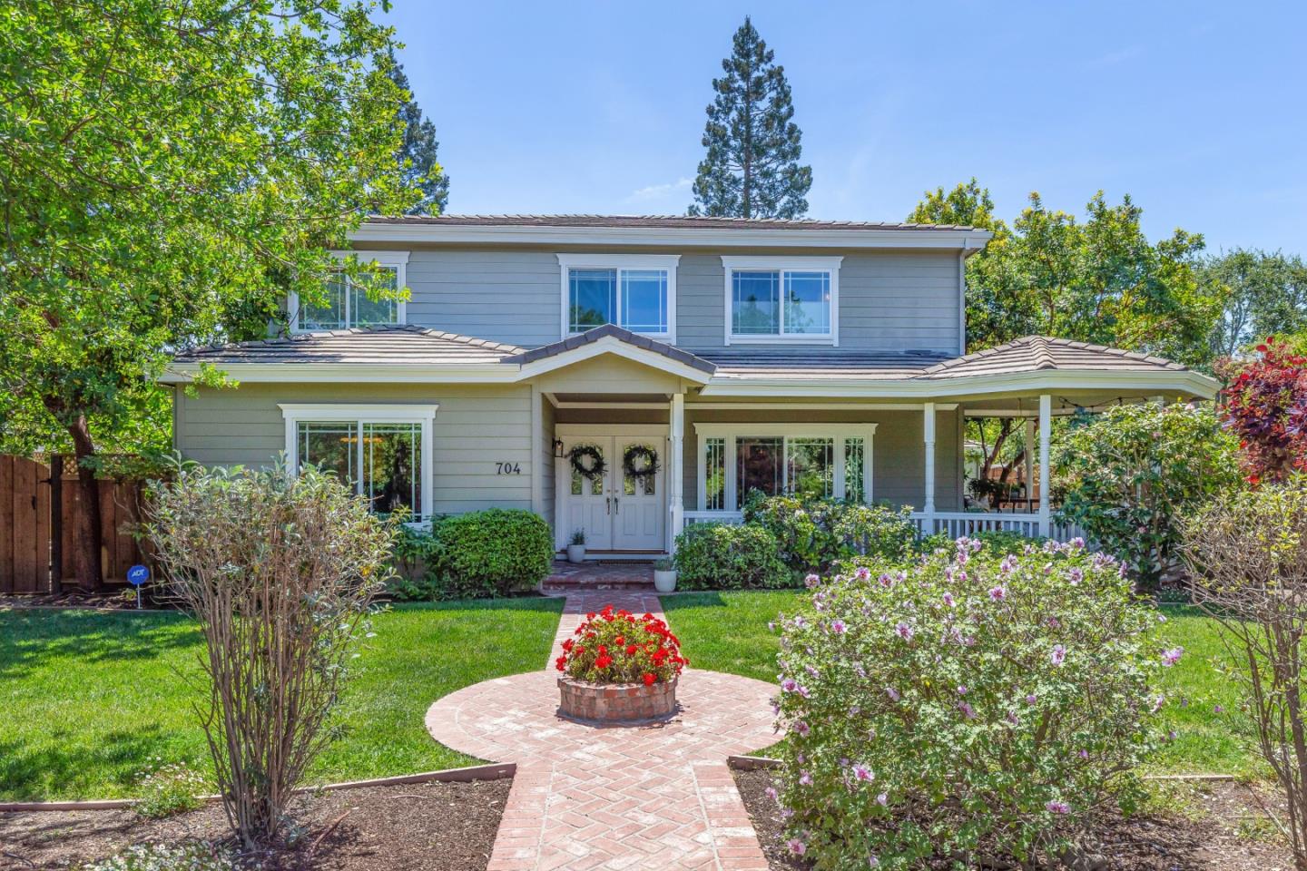 704 Covington Road Los Altos, CA 94024 - Photo 2 of 2 a front view of a house with a yard
