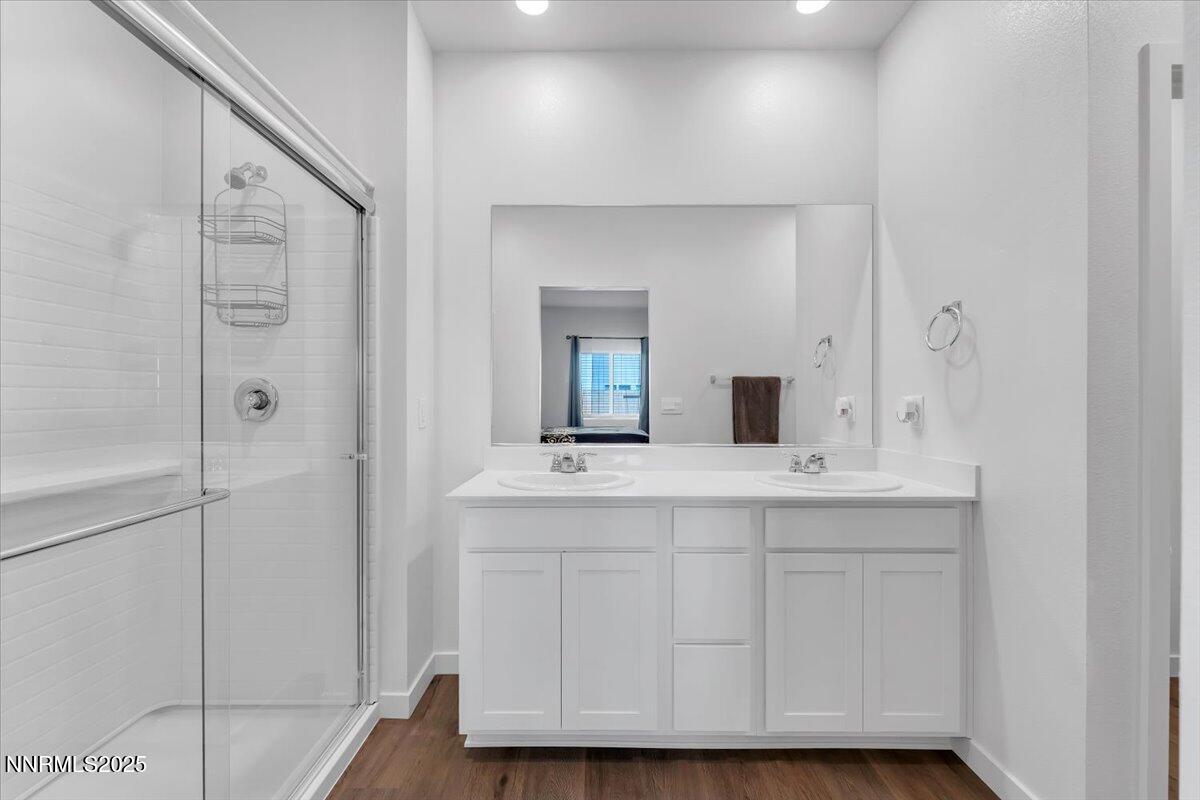 7523 Grassy Plains Drive Reno, NV 89506 - Photo 13 of 22 a bathroom with a sink and a mirror