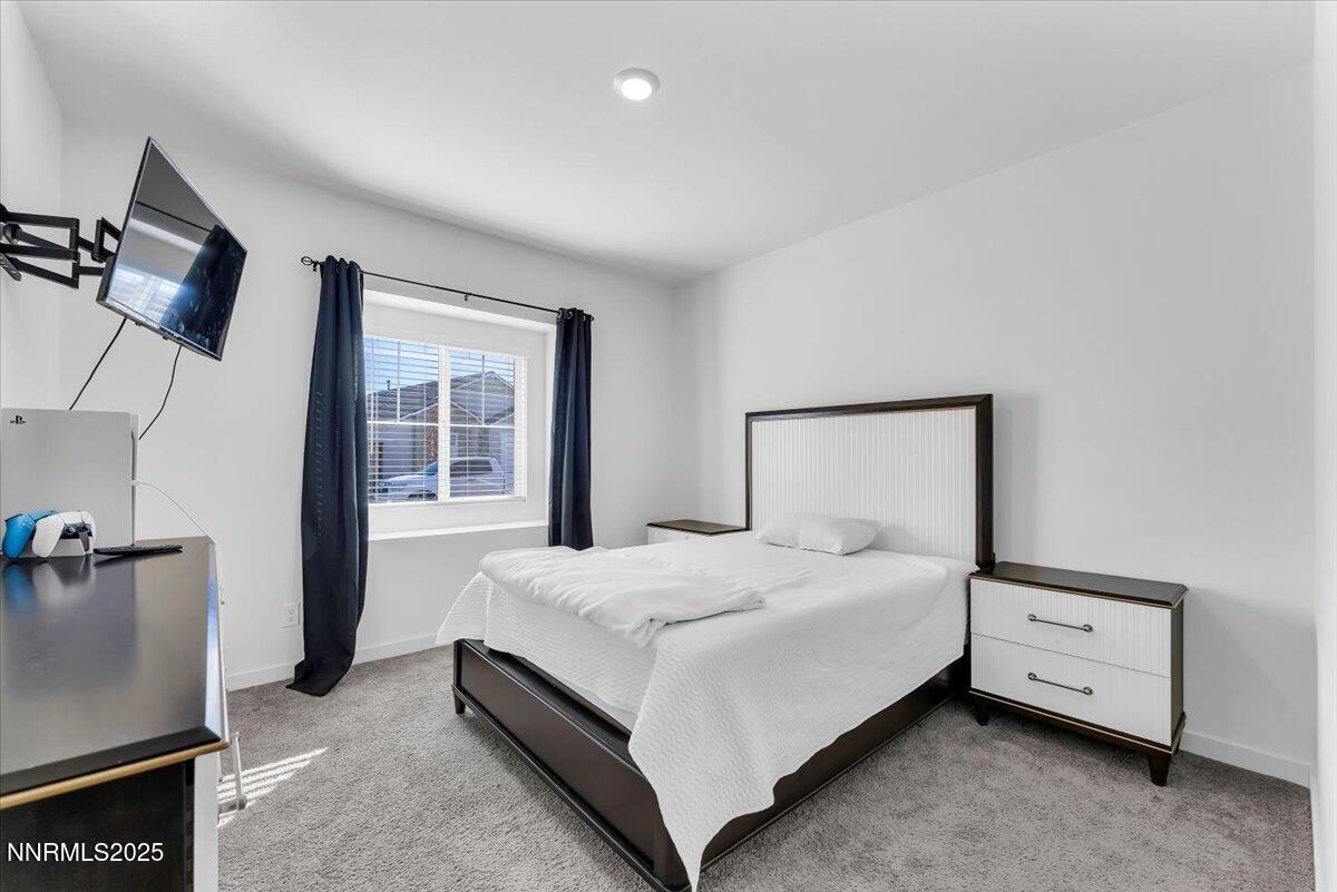 7523 Grassy Plains Drive Reno, NV 89506 - Photo 14 of 22 a bedroom with a bed and a night stand