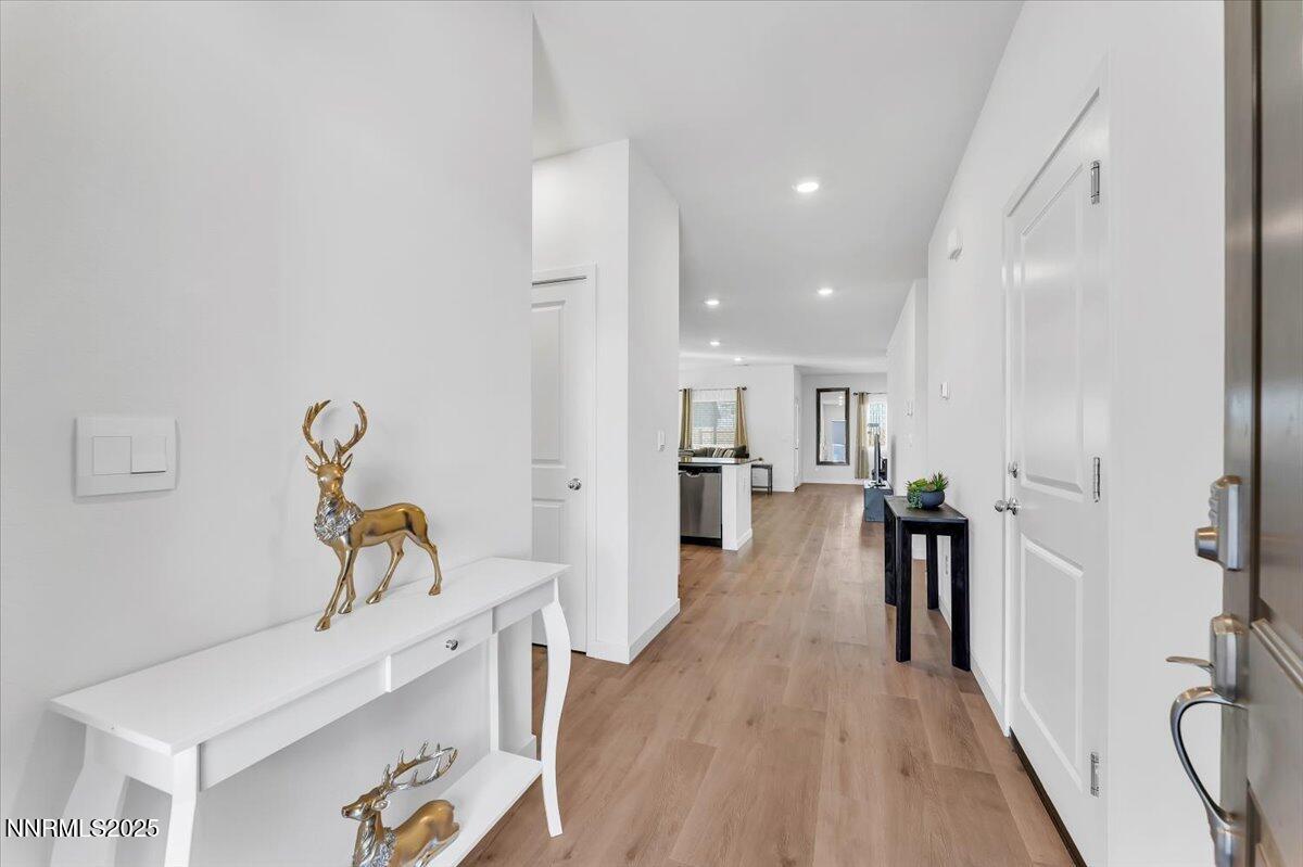 7523 Grassy Plains Drive Reno, NV 89506 - Photo 3 of 22 a view of a room with wooden floor