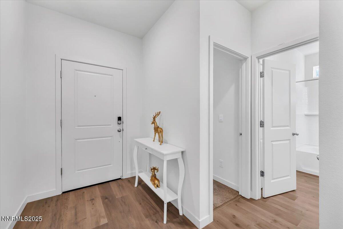 7523 Grassy Plains Drive Reno, NV 89506 - Photo 4 of 22 a view of an entryway with wooden floor