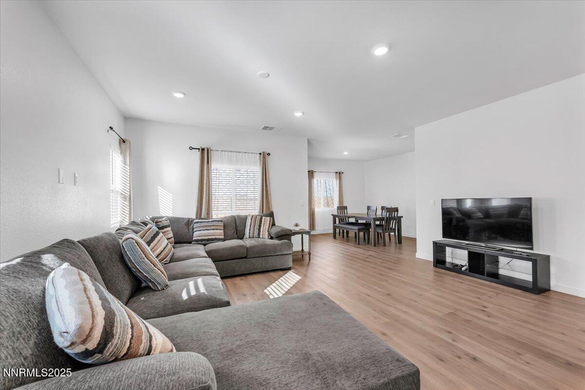 7523 Grassy Plains Drive Reno, NV 89506 - Photo 7 of 22 a living room with furniture and a flat screen tv