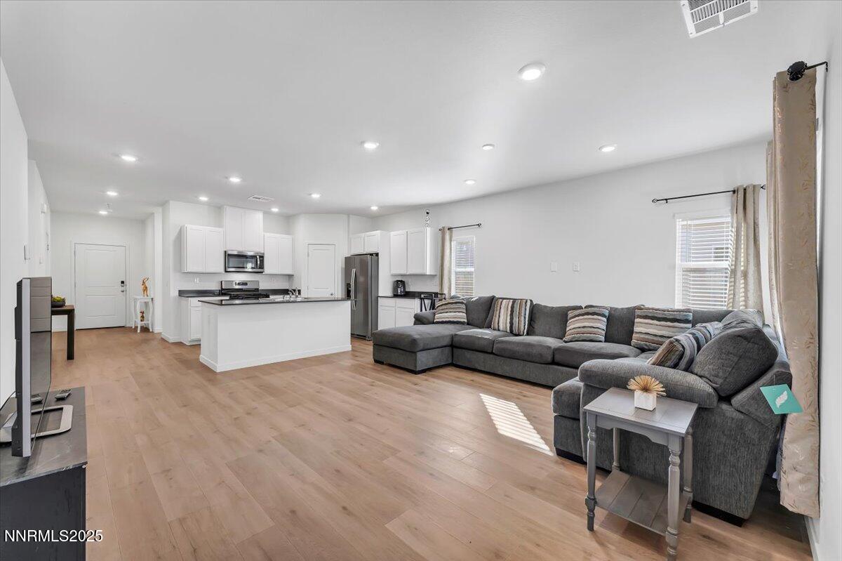 7523 Grassy Plains Drive Reno, NV 89506 - Photo 9 of 22 a living room with furniture and kitchen view