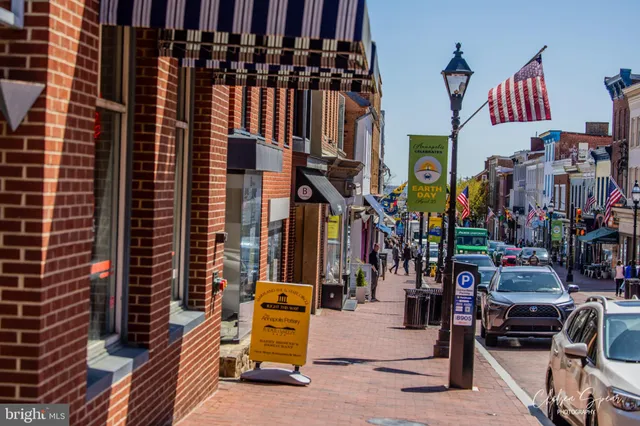 a view of path along with retail shop and buildings