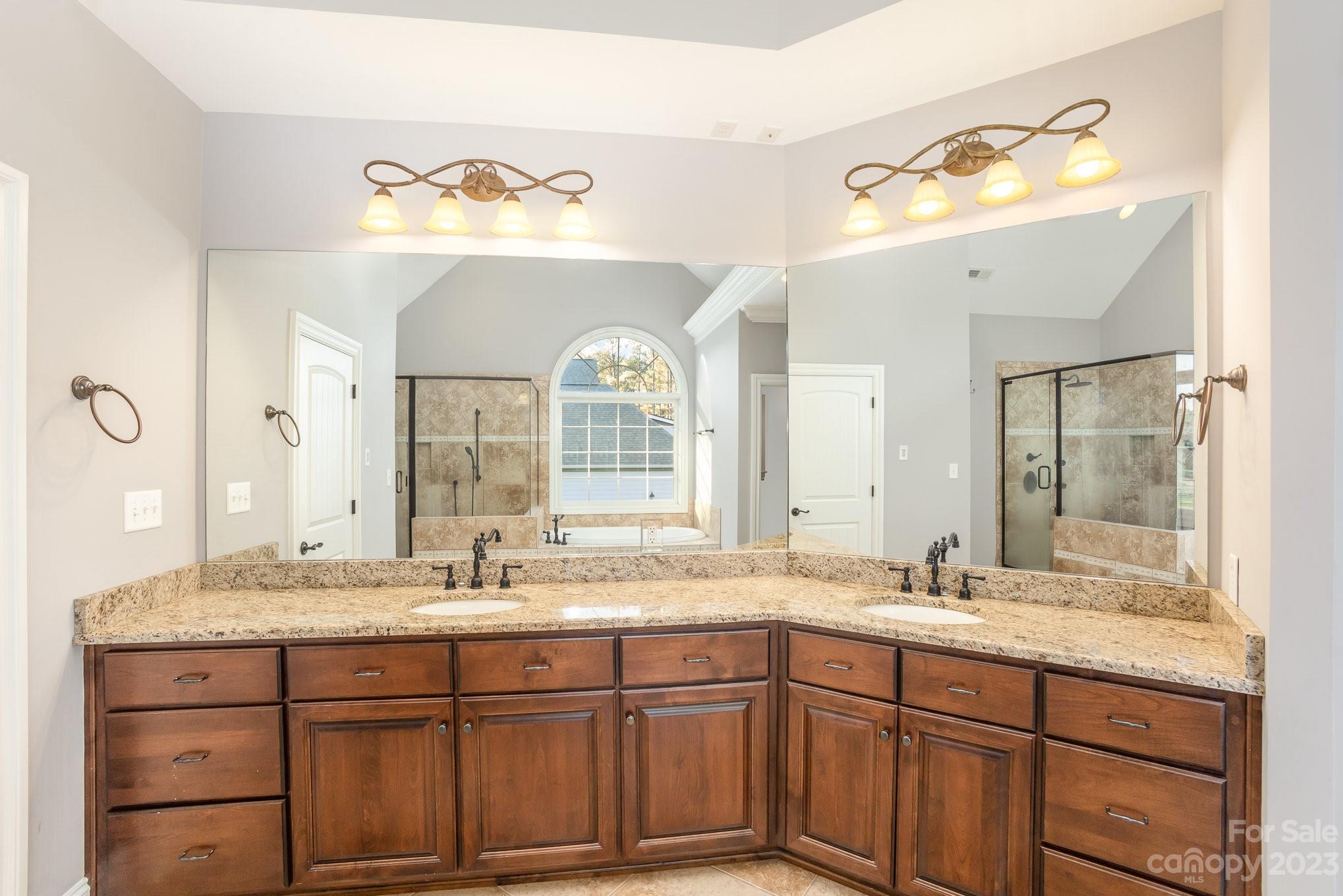 142 Blue Ridge Trail Mooresville, NC 28117 - Photo 17 of 32 a bathroom with a granite countertop sink mirror and