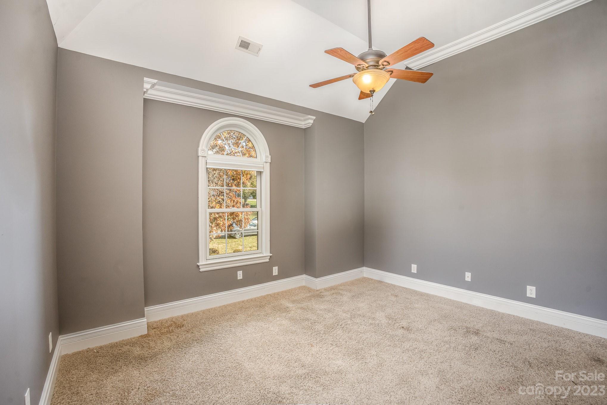 142 Blue Ridge Trail Mooresville, NC 28117 - Photo 21 of 32 a view of a big room with windows and chandelier fan