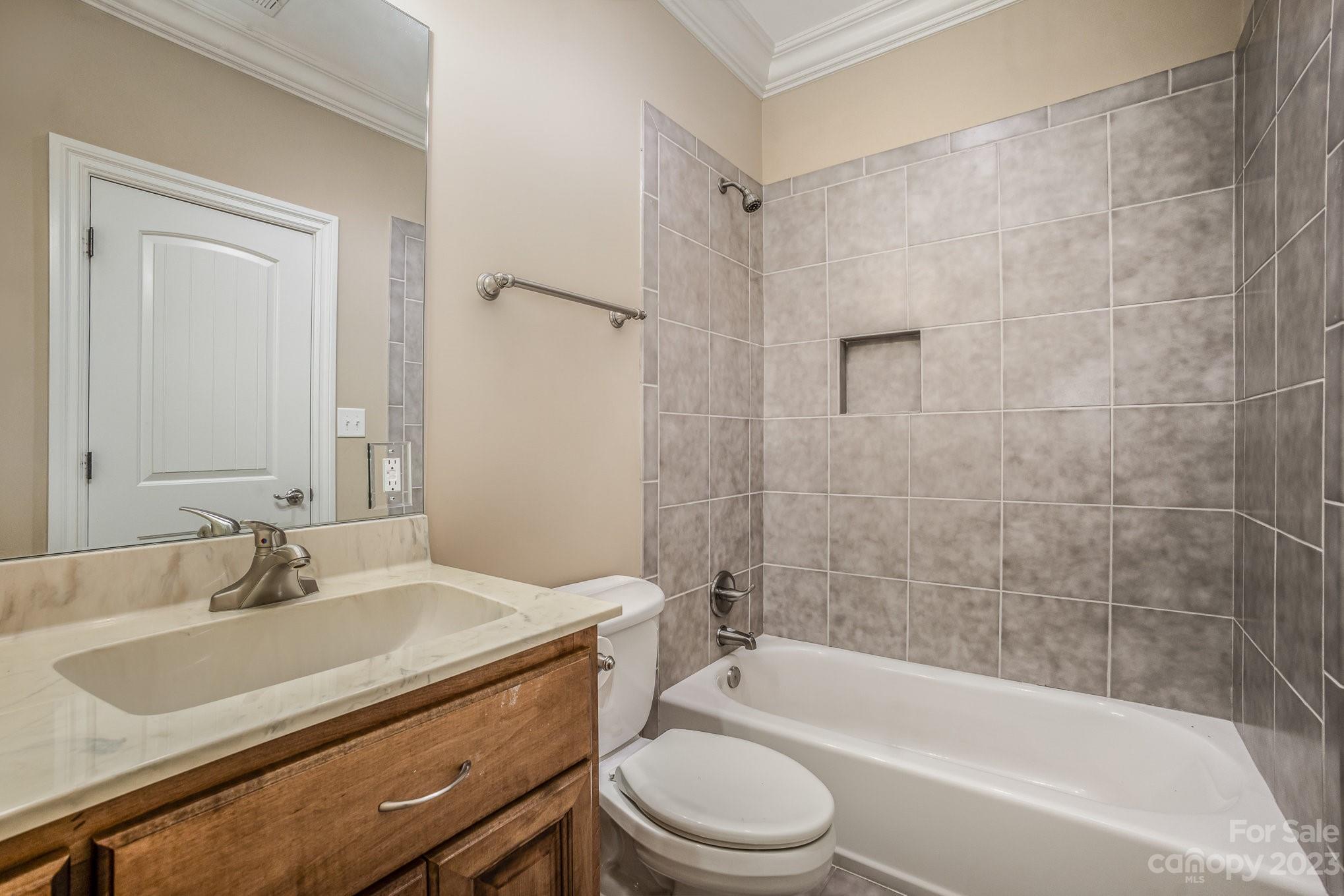 142 Blue Ridge Trail Mooresville, NC 28117 - Photo 23 of 32 a bathroom with a sink a toilet and shower