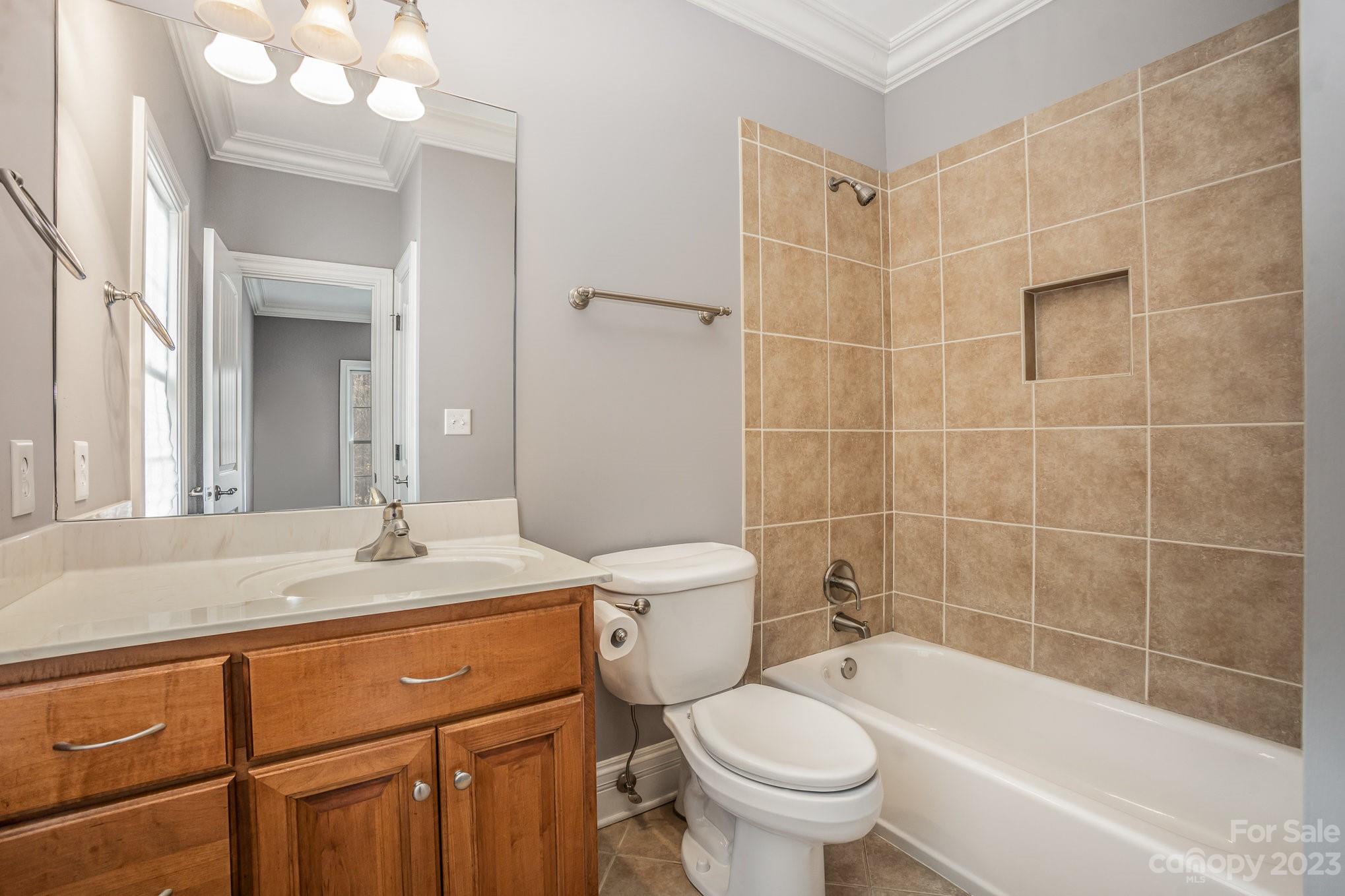 142 Blue Ridge Trail Mooresville, NC 28117 - Photo 26 of 32 a bathroom with a sink toilet vanity and bathtub