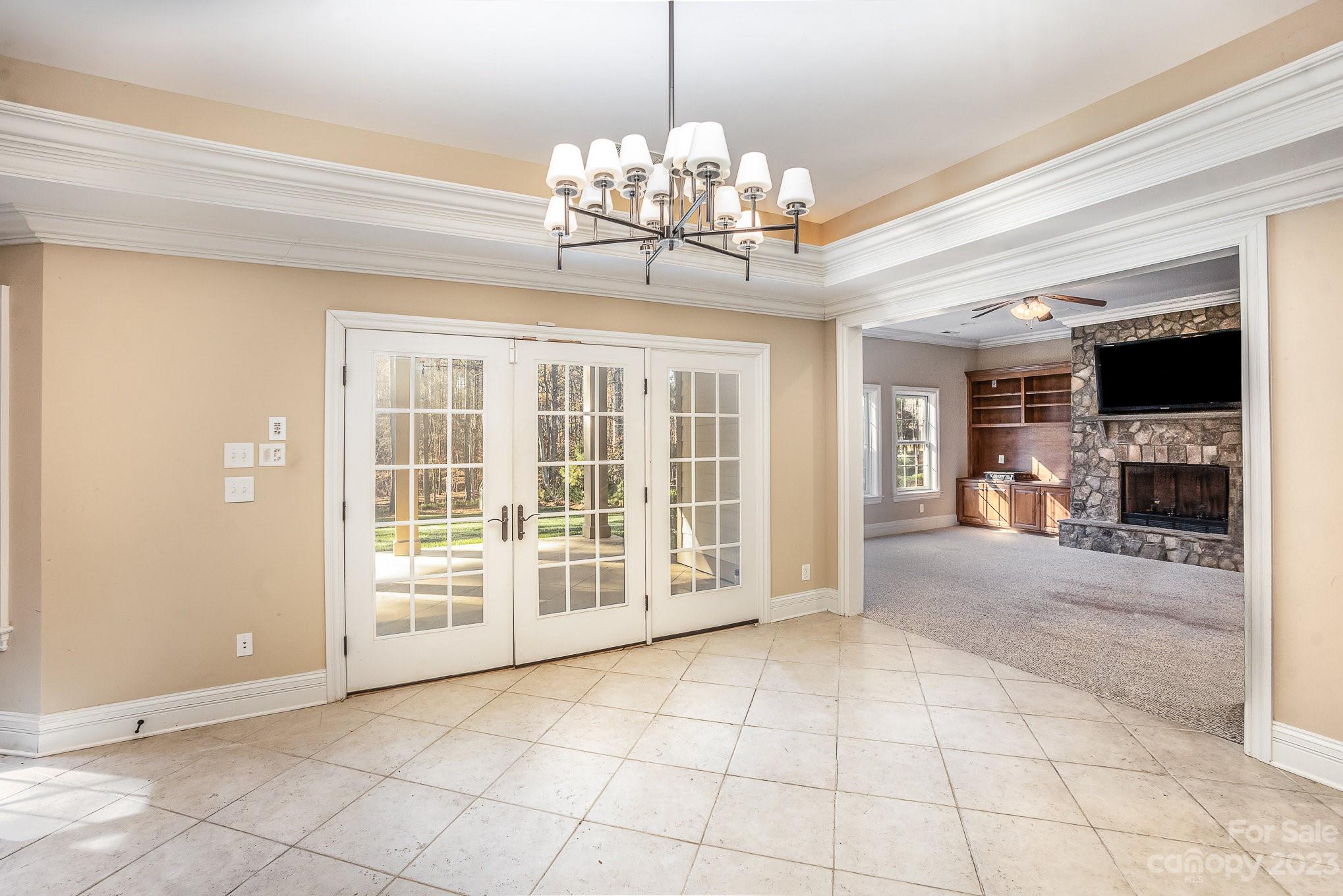 142 Blue Ridge Trail Mooresville, NC 28117 - Photo 28 of 32 a view of an empty room with window and chandelier