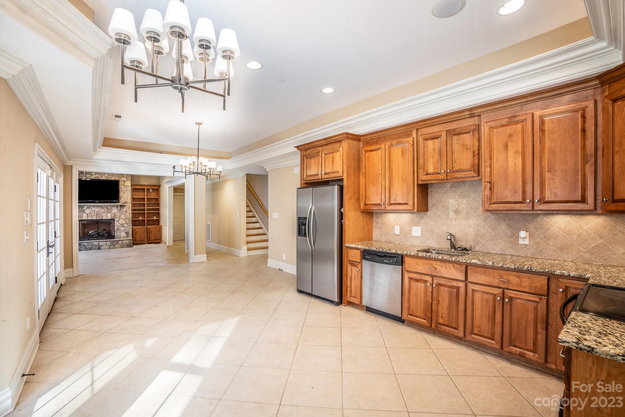 142 Blue Ridge Trail Mooresville, NC 28117 - Photo 29 of 32 a large kitchen with stainless steel appliances granite countertop a refrigerator and a sink