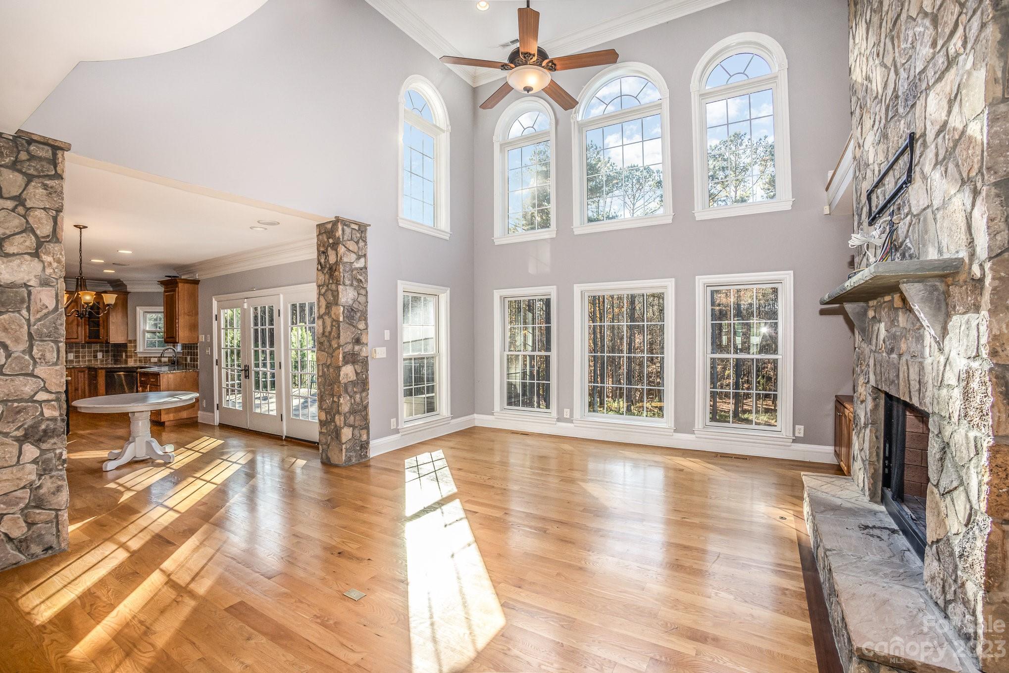 142 Blue Ridge Trail Mooresville, NC 28117 - Photo 3 of 32 a view of an entryway with wooden floor and a fireplace