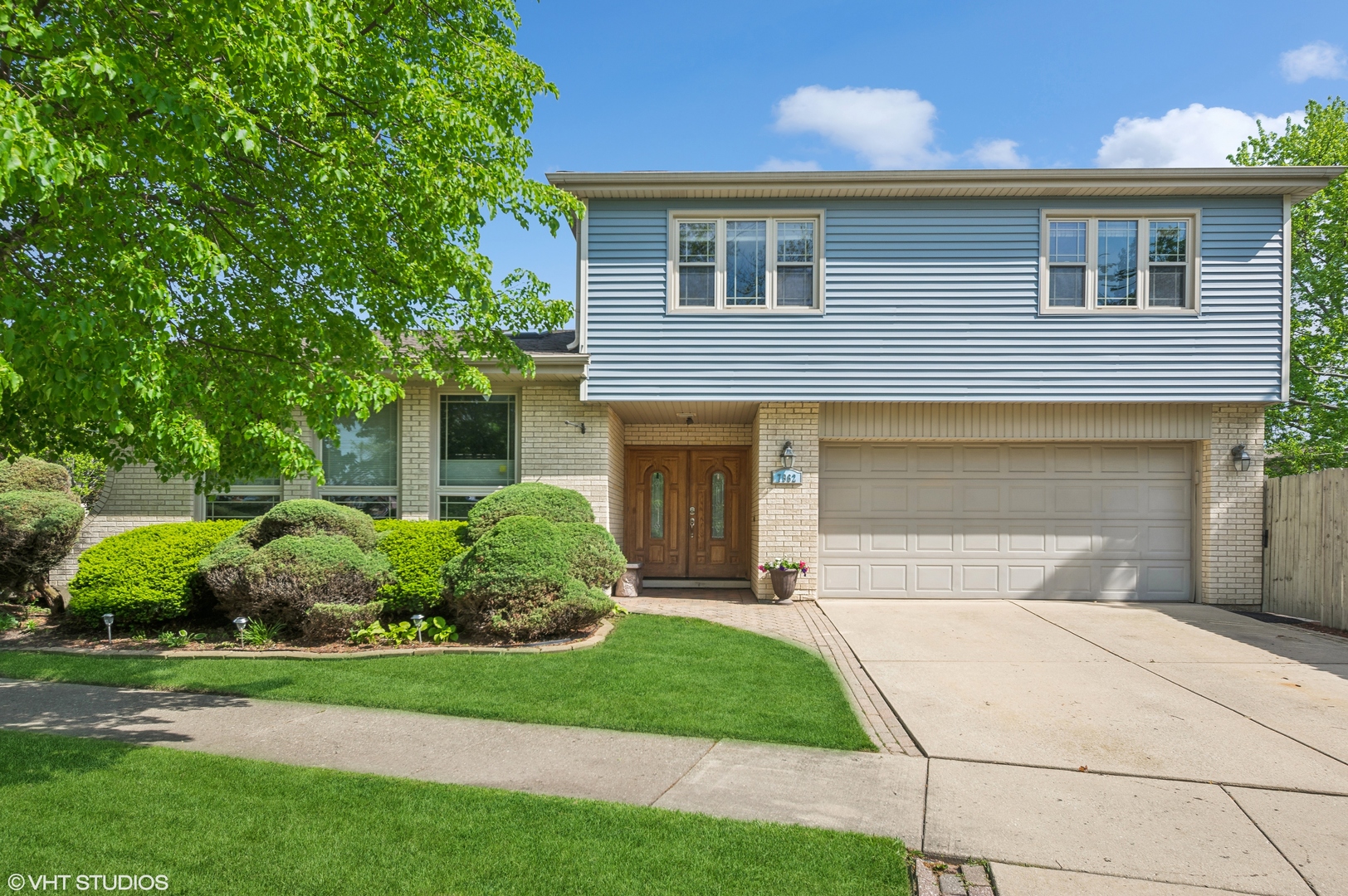 7962 Beckwith Road Morton Grove, IL 60053 - Photo 1 of 30 a front view of a house with a yard and garage