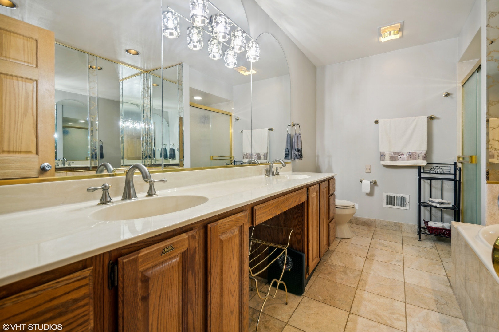 7962 Beckwith Road Morton Grove, IL 60053 - Photo 12 of 30 a spacious bathroom with a double vanity sink a and a mirror