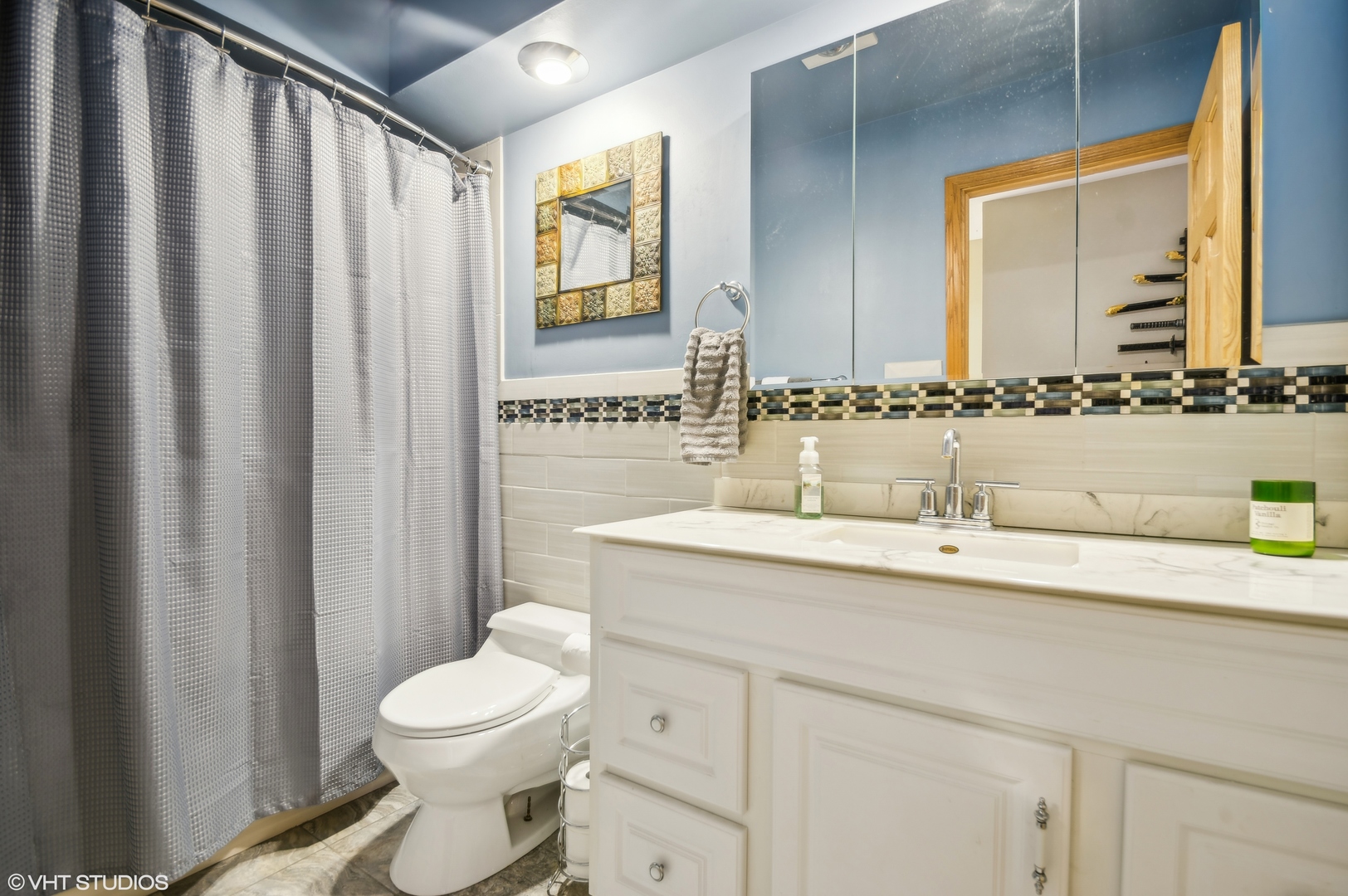7962 Beckwith Road Morton Grove, IL 60053 - Photo 17 of 30 a bathroom with a granite countertop sink toilet and mirror