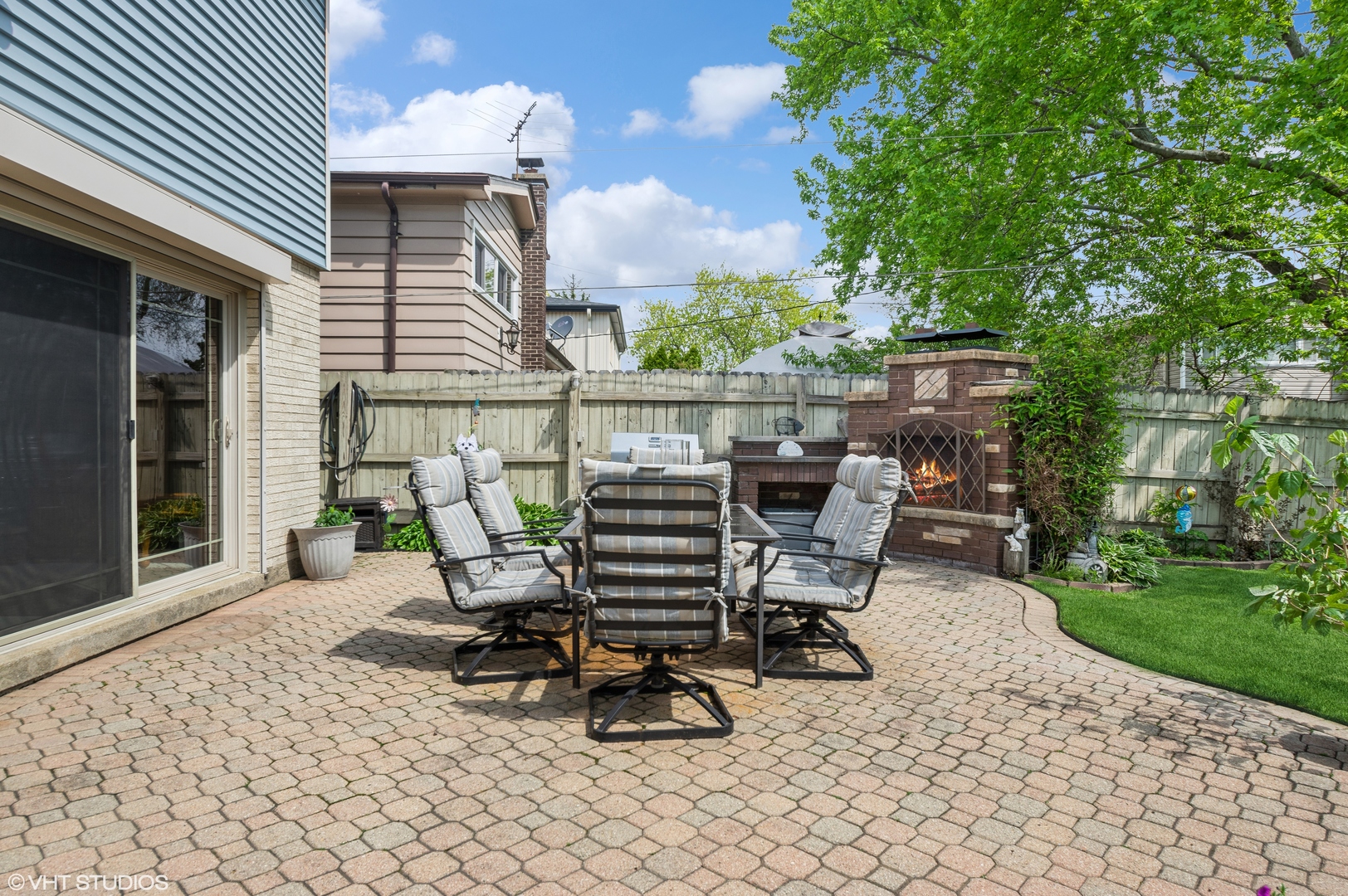 7962 Beckwith Road Morton Grove, IL 60053 - Photo 22 of 30 a view of a chairs and table in backyard of the house