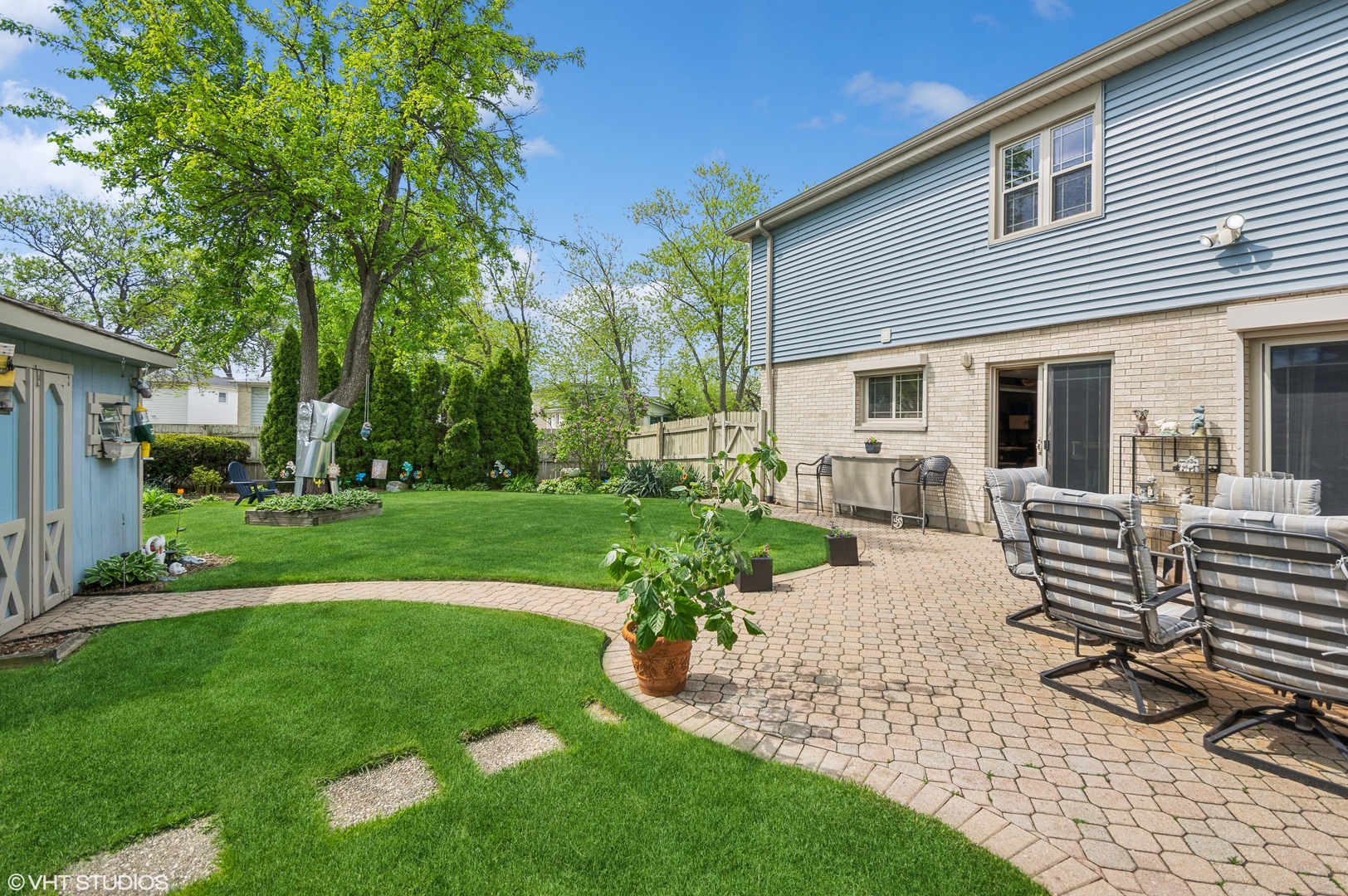 7962 Beckwith Road Morton Grove, IL 60053 - Photo 24 of 30 a view of a house with backyard porch and sitting area