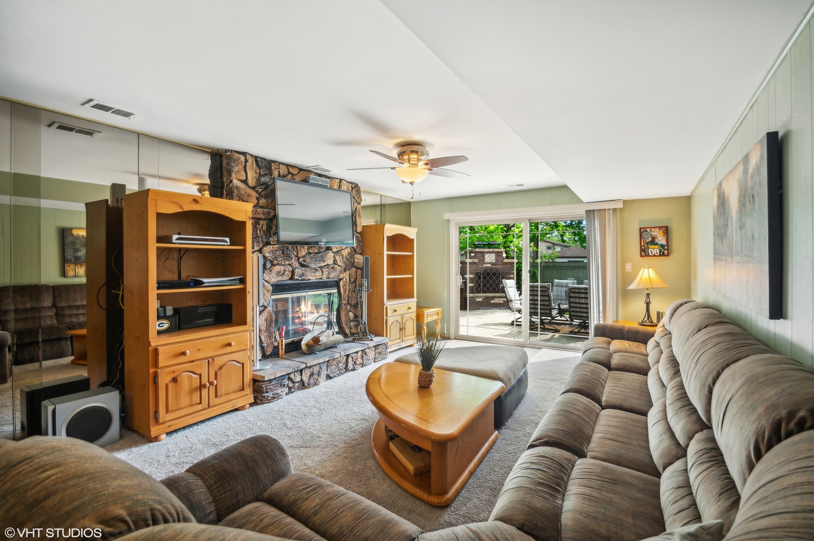 7962 Beckwith Road Morton Grove, IL 60053 - Photo 3 of 30 a living room with furniture ceiling fan and a window