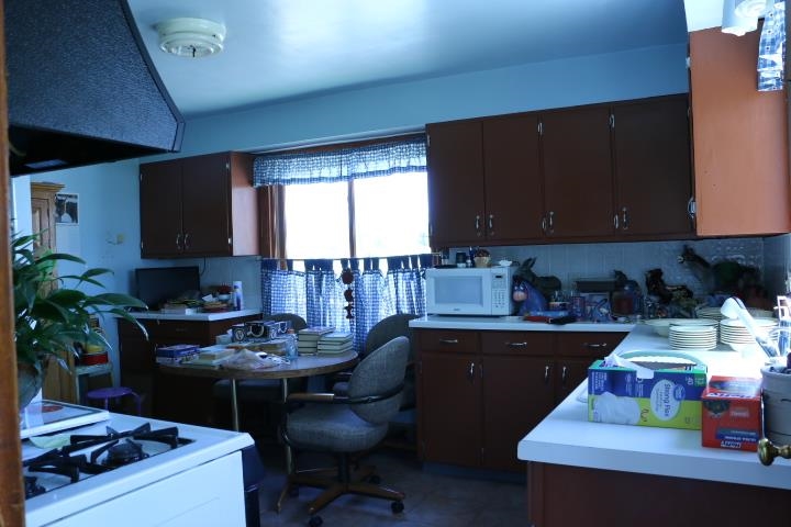 3354 Goeke Road Pecatonica, IL 61063 - Photo 3 of 7 a kitchen with a cabinets and appliances