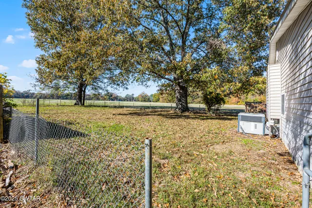 a view of a yard with an outdoor seating