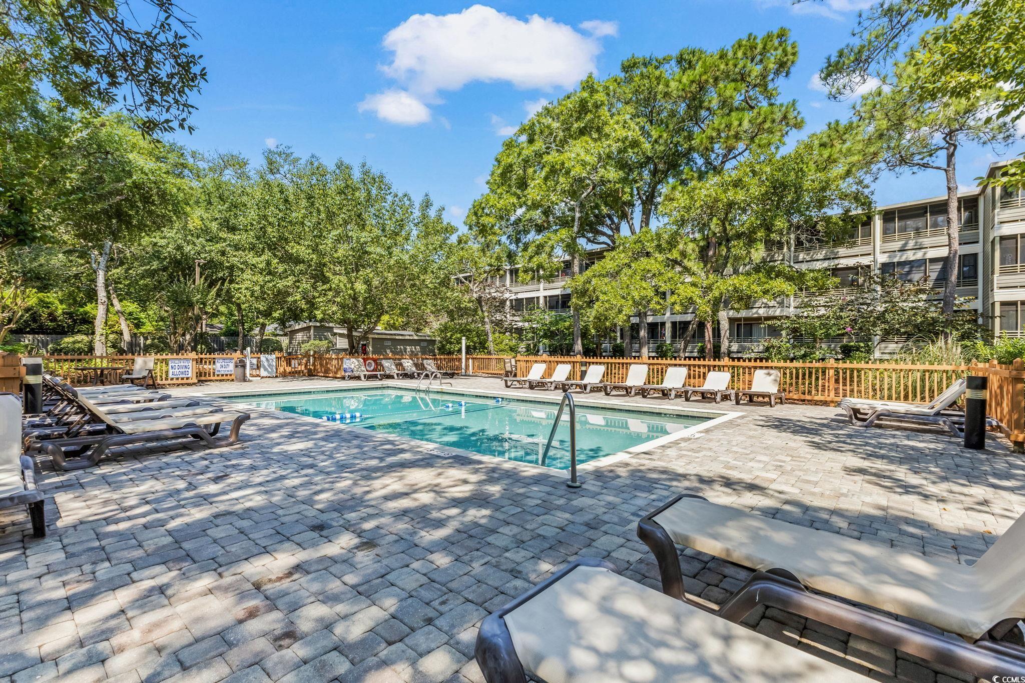 415 Ocean Creek Drive, Unit 2346 Myrtle Beach, SC 29572 - Photo 30 of 40 Community pool featuring a patio area