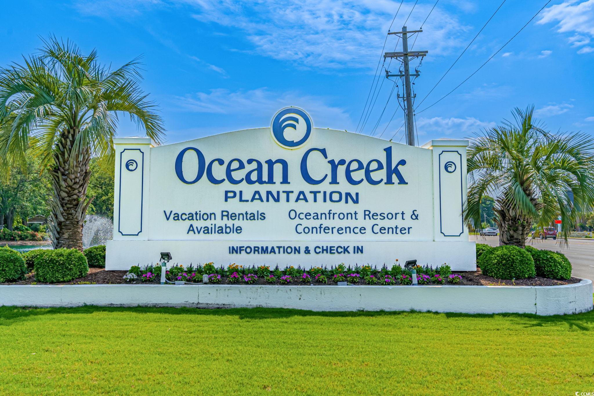 415 Ocean Creek Drive, Unit 2346 Myrtle Beach, SC 29572 - Photo 40 of 40 Community / neighborhood sign featuring a lawn
