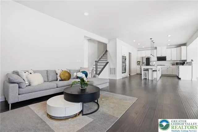 a view of a dining room with furniture wooden floor and chandelier