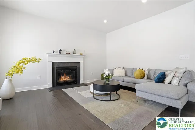 a view of a dining room with a table and chairs