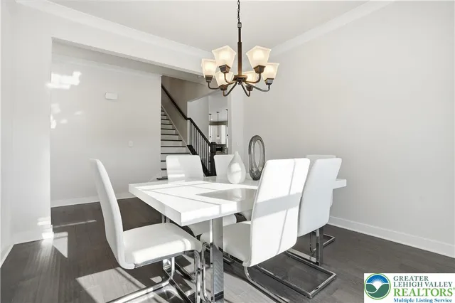 a spacious bedroom with a bed and a potted plant