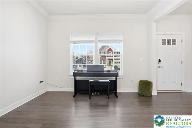 a room with furniture pool table and windows