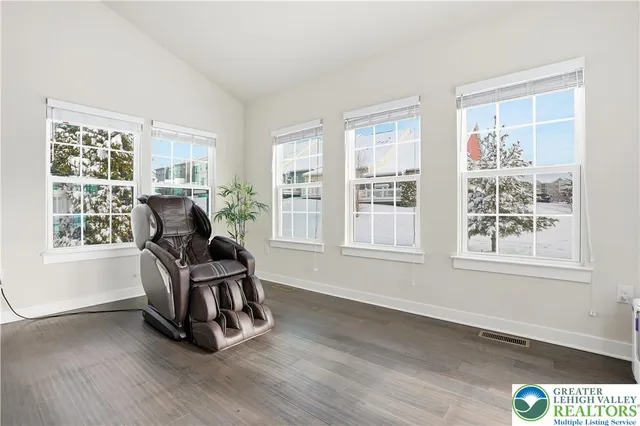 a living room with furniture and a stairs