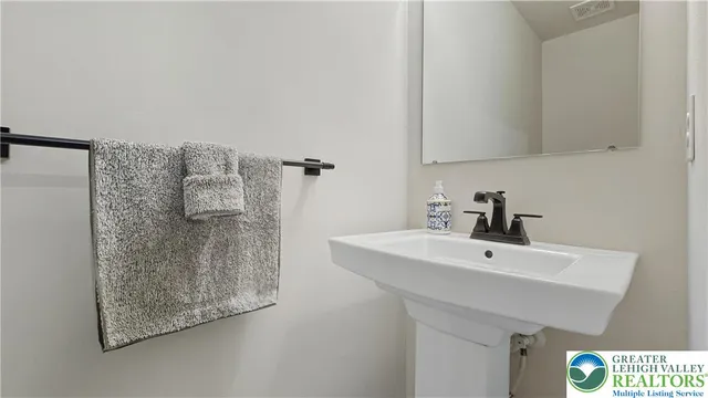 a living room with furniture and white walls