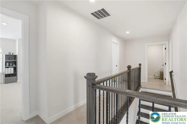 a front view of a house with parking space