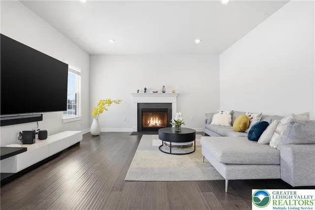 a kitchen with stainless steel appliances white cabinets and a stove top oven