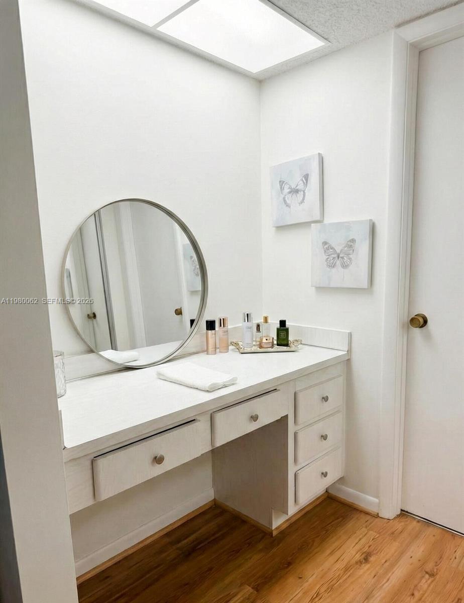 100 Ashbury Road, Unit 305 Hollywood, FL 33024 - Photo 7 of 8 a bathroom with a sink and a mirror
