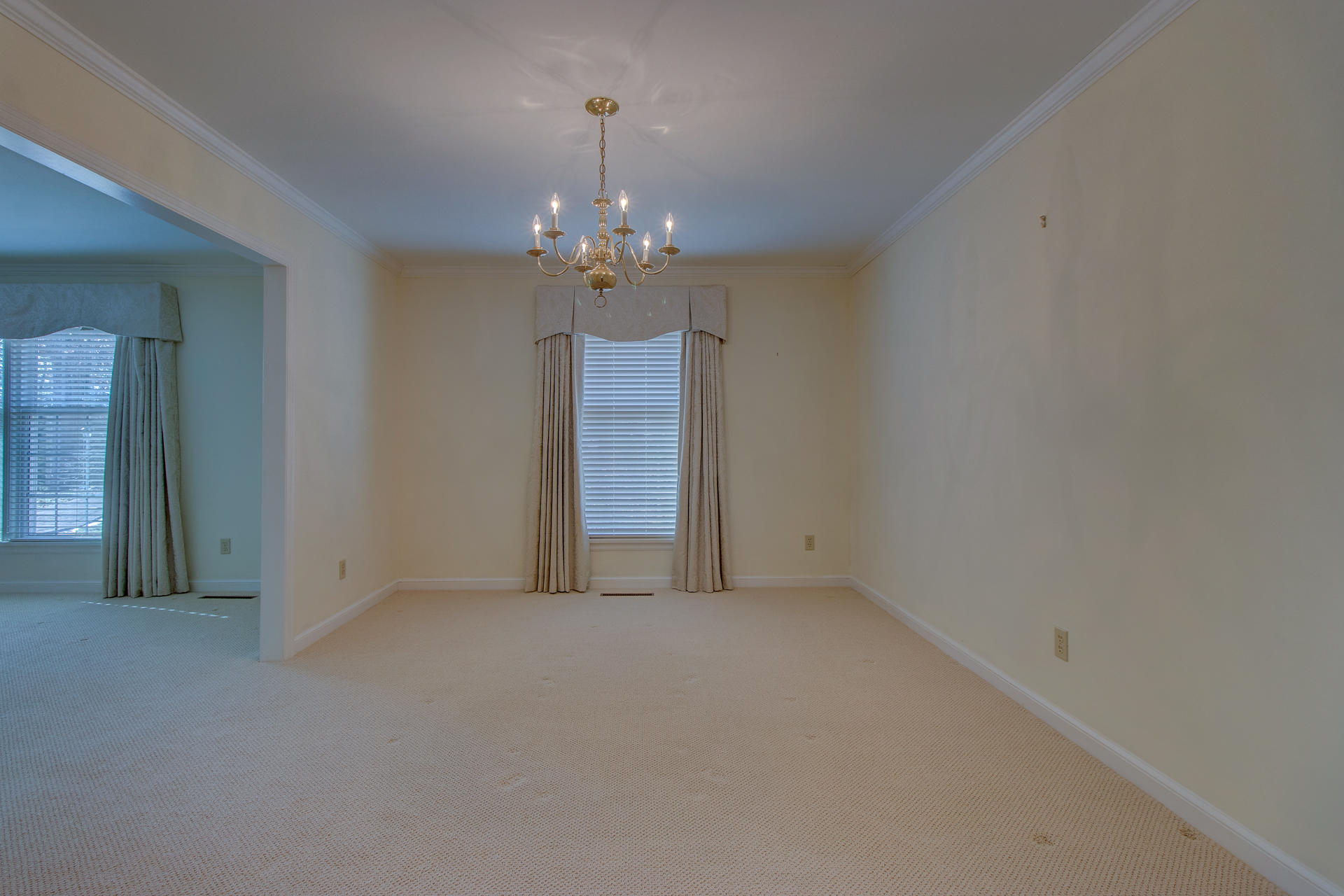 5123 Falcon Ridge Road Roanoke, VA 24018 - Photo 11 of 32 en empty room with windows and chandelier