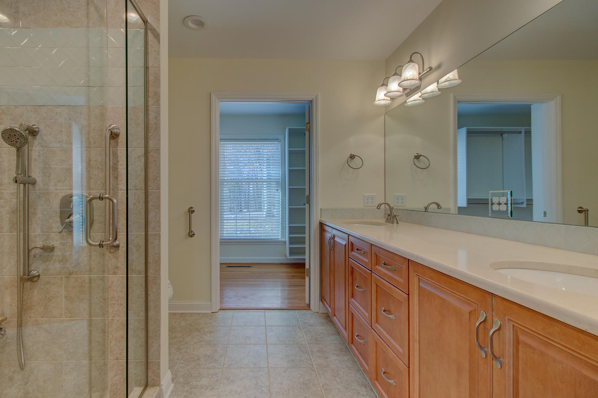 5123 Falcon Ridge Road Roanoke, VA 24018 - Photo 22 of 32 a spacious bathroom with a granite countertop sink a mirror and a shower
